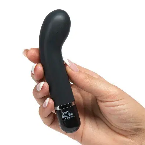 Fifty Shades of Grey Insatiable Desire Mini Silicone G-Spot Vibrator in hand